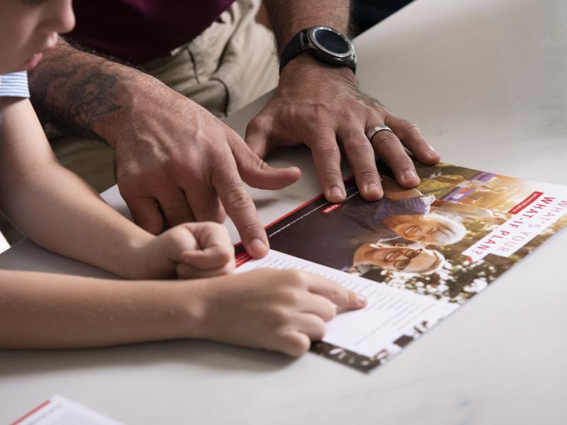 Close up of family checking emergency plan